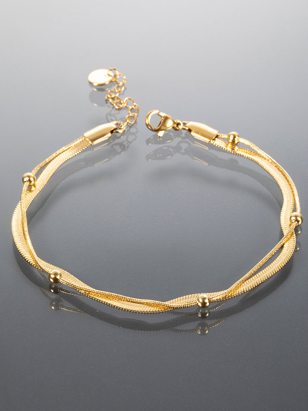 Minimalistický náramek z chirurgické oceli zlatý NM3061-0114