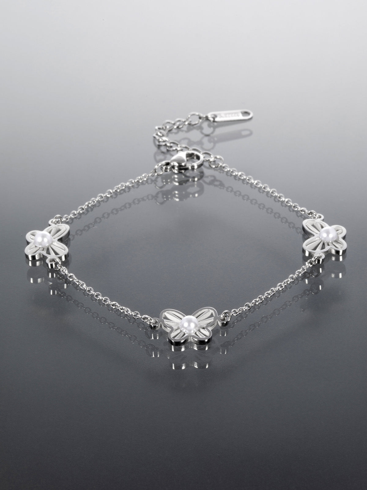 Náramek z chirurgické oceli s motýlky NM3179-0112