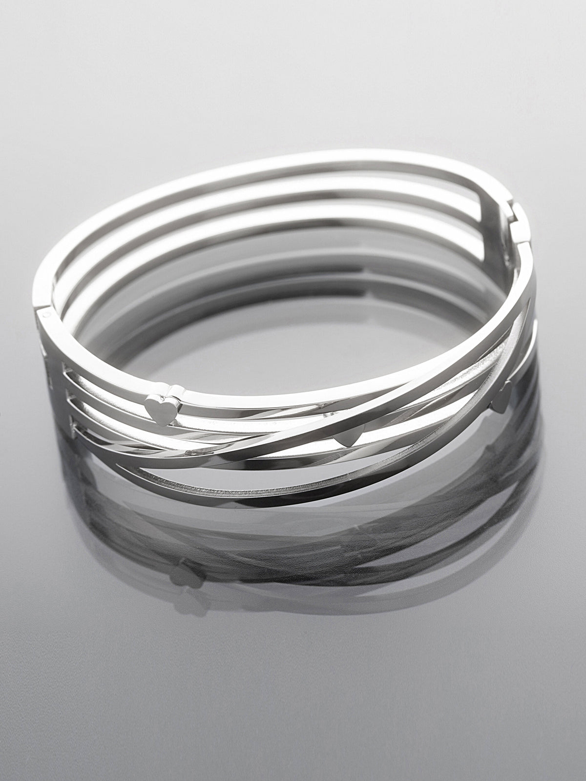 Pevný náramek z leštěné chirurgické oceli z několika pramenů NM3319-0112