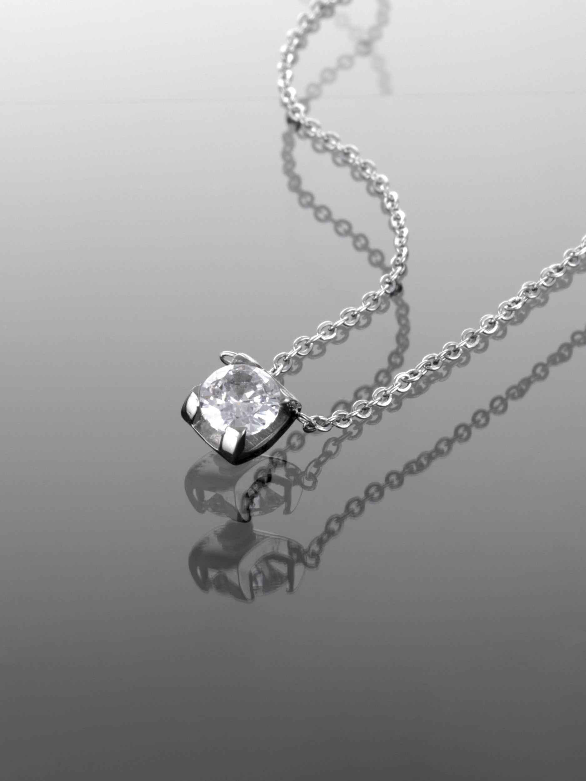 Ocelový náhrdelník s elegantním čirým krystalem NK0627-0107