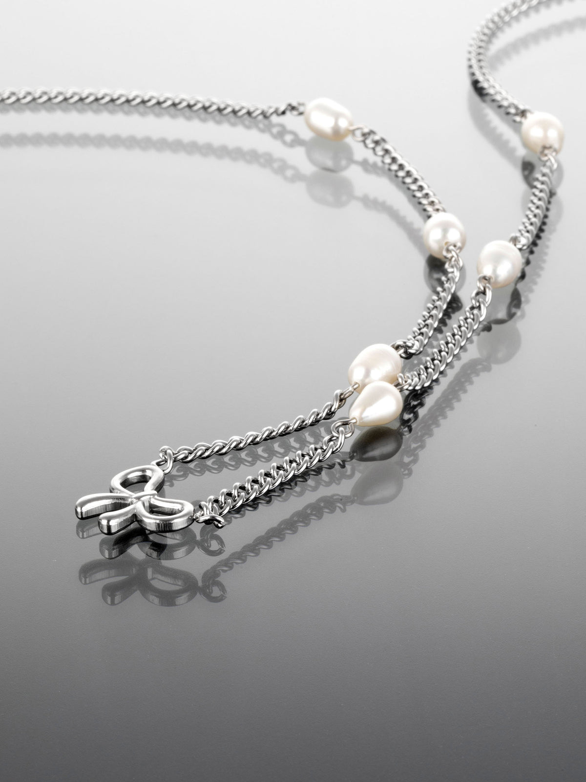 Krásný náhrdelník z chirurgické oceli s mašličkou a perlami NK1127-0112